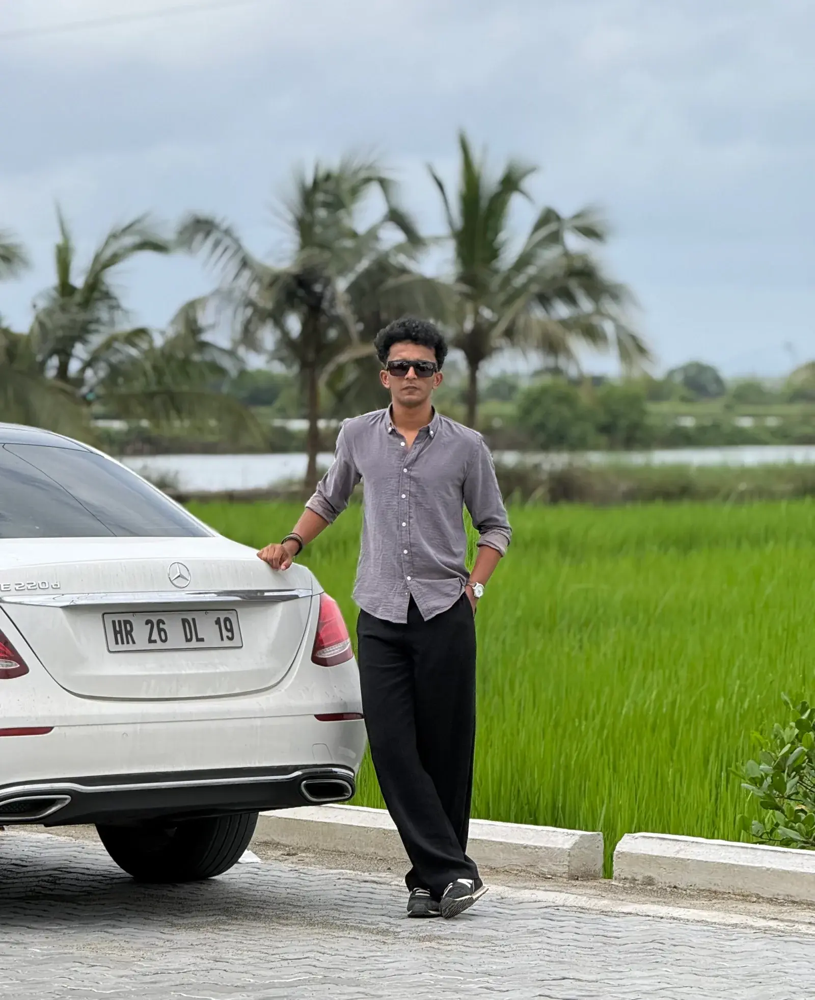 best freelance digital marketer in malappuram standing photo on car